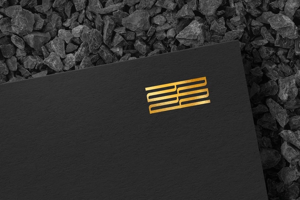 Elegant Gold Foil Logo Mockup on Black Paper