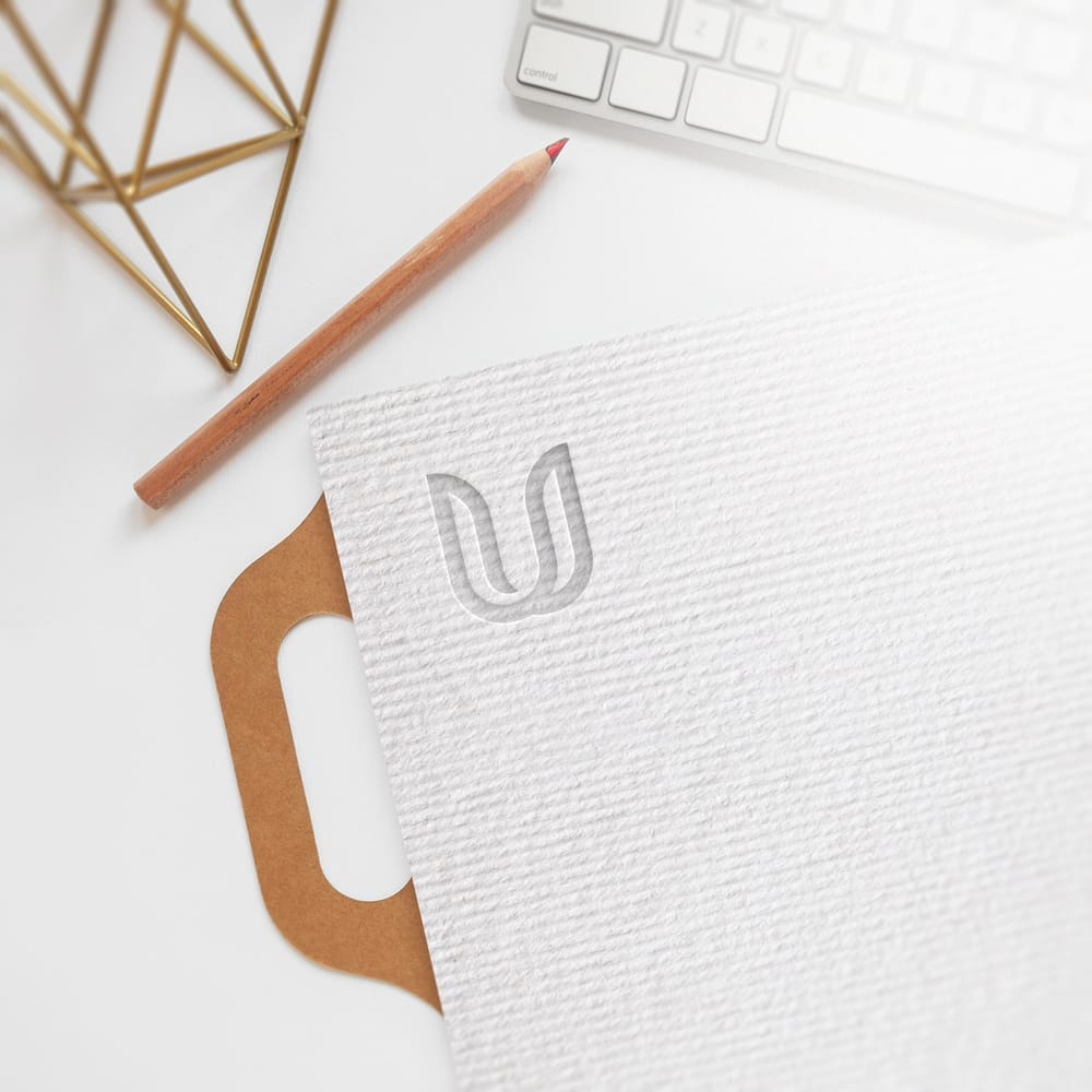 Embossed Logo Mockup With Office Desk