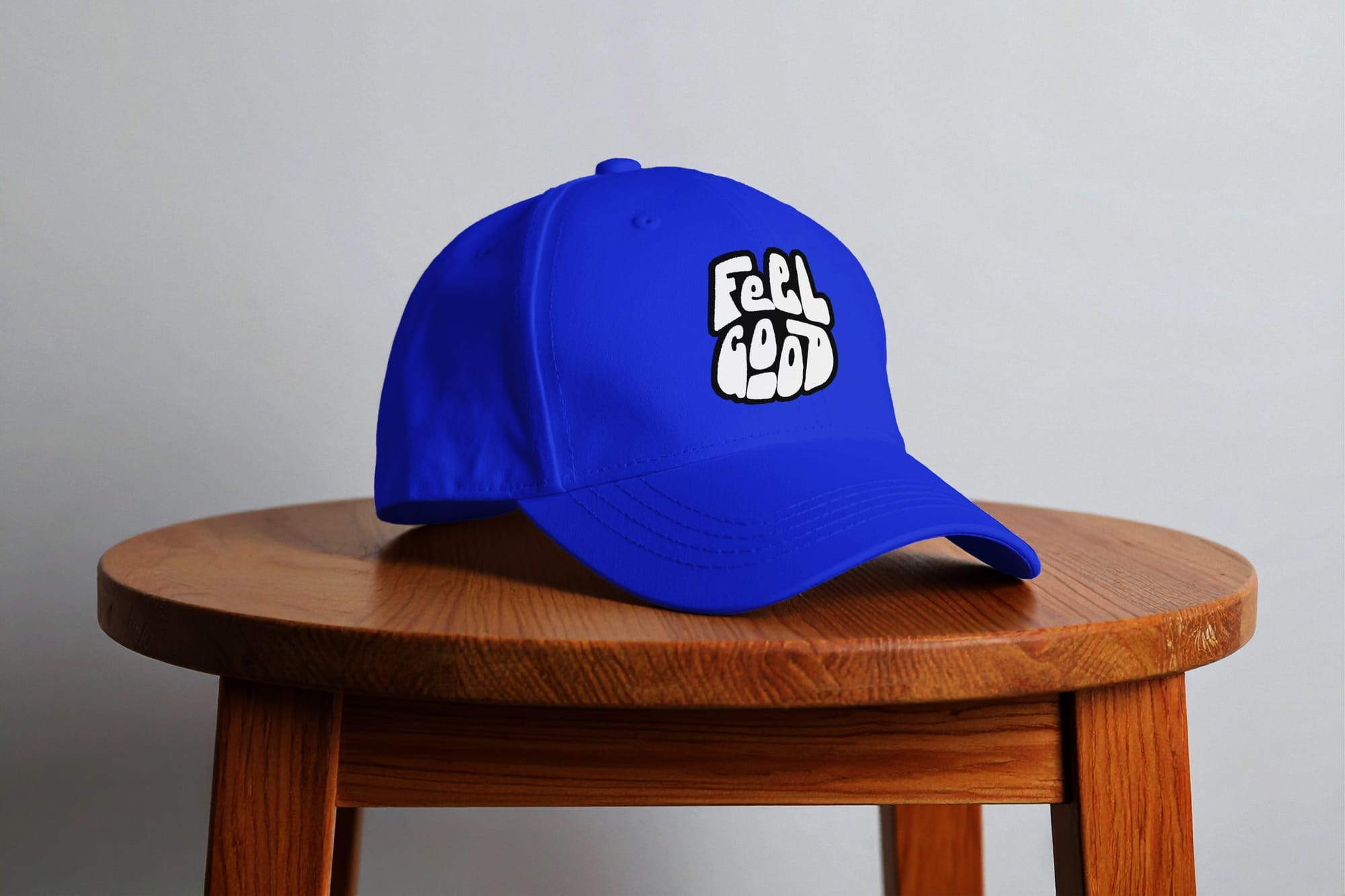 Minimalist Baseball Cap Mockup on Wooden Stool