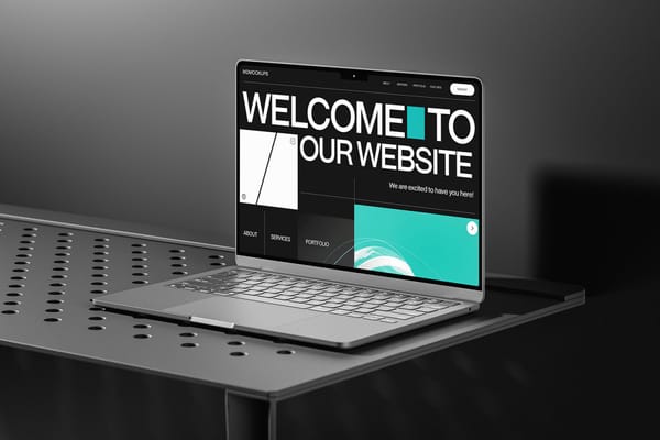 MacBook on Black Table Mockup