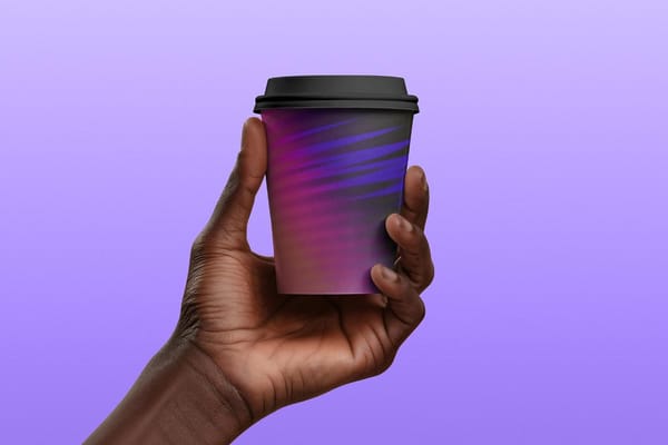 Hand Holding Paper Cup Mockup